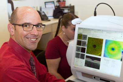 Dr. Cole conducts a comprehensive eye exam